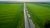 convoys with cargo. trucks on the higthway sunset. cargo delivery driving on asphalt road along the green fields. seen from the air. Aerial view landscape. drone photography.; Shutterstock ID 1480353326; Purchase Order: 143305751; Job: 14319298; Client/Licensee: BP